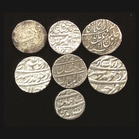 A lot of 7 Mughal Silver Coins. Various rulers and dates. (7 Coins)