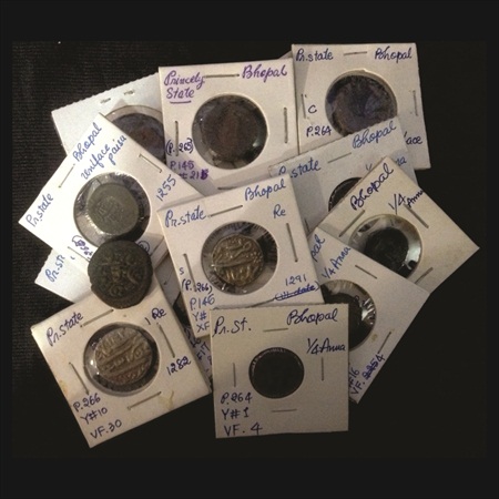 A lot of 15 Coins, 2x Silver and 13x Copper. 2x Silver Rupees of Bhopal and 11x Copper coi