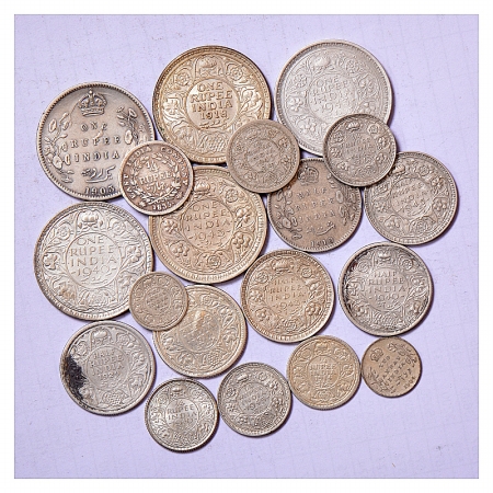 A group of 19 Silver and Half Silver coins of British India, includes Rupee, 1/2 Rupee, 1/