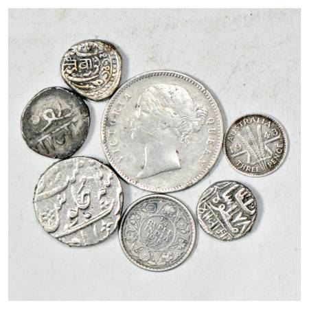 A group of 7 Silver Rupee Coins , includes State, British India, etc. Various denomination