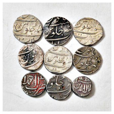 A group of 9 Mughal silver ½ rupees, various rulers, mints, dates and types. (9 coins)